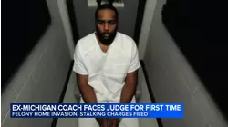 Fired Michigan football coach charged with home invasion, stalking