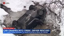 Driver rescued after crashing into icy creek in Elgin