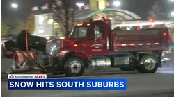 Snow plows working to clear roads in County Club Hills on Monday