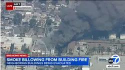 Fire at Inglewood commercial building sends up plume of black smoke, injures 2 firefighters