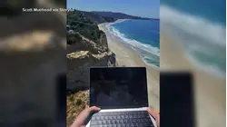 Remote worker paraglides on the job