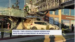 2-car collision sends SUV through glass storefront in Hicksville