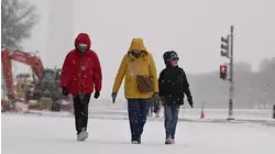 Snow and Ice Cause Pileups on Highways and Flight Delays