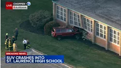 SUV slams into south suburban high school
