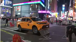 SUV taxi gets wedged on piece of metal in middle of Times Square; no injuries