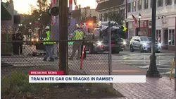 Woman sent to hospital after train hits car on tracks in Ramsey
